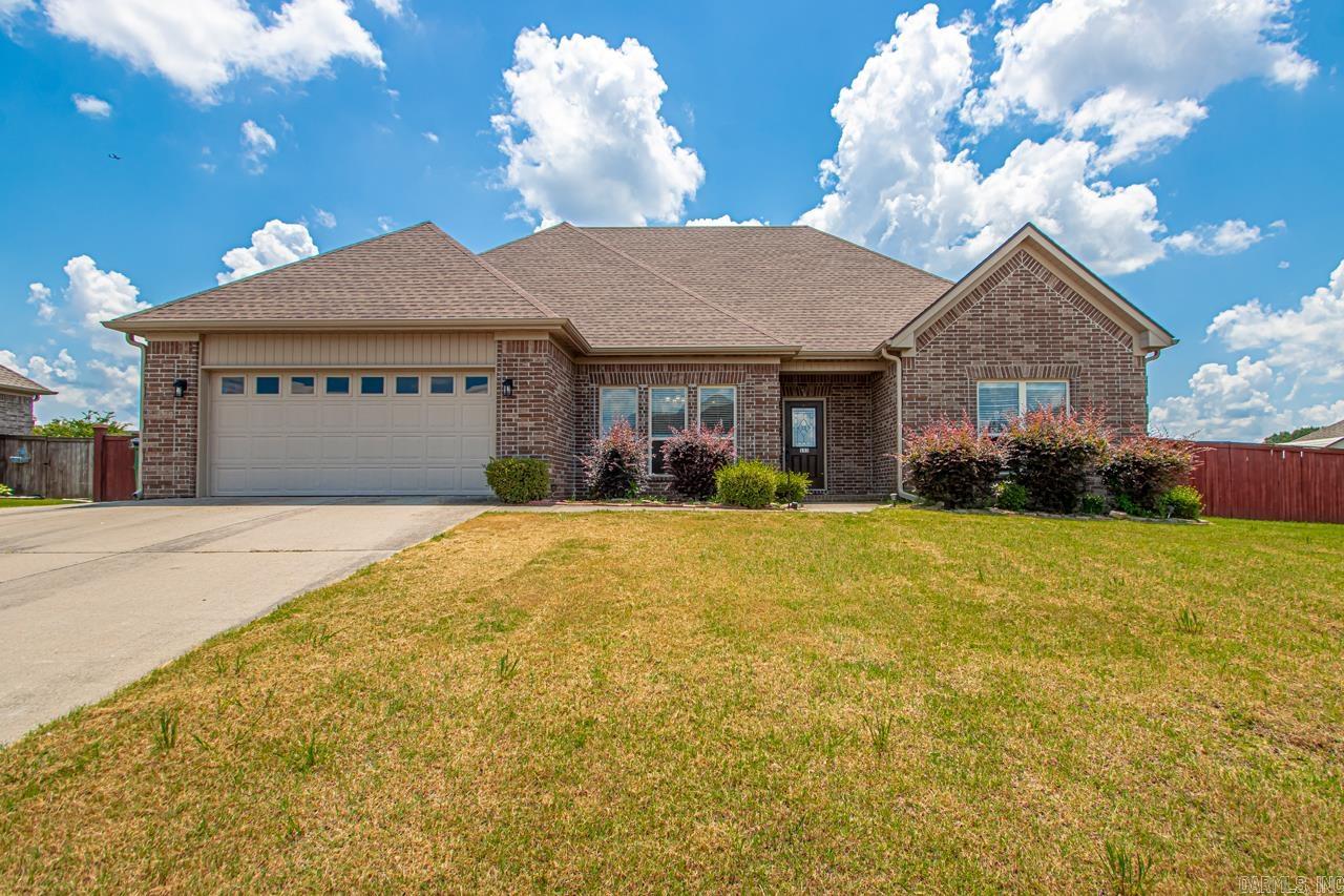 Welcome to 153 Crystal Lake Rd in Austinās desirable Shadow Creek Subdivision II! This beautifully maintained 3-bedroom, 2-bath home offers over 2,000 sq ft of elegant living. Step inside to stunning hardwood floors, trayed ceilings, and an open, split floor plan perfect for modern living. The spacious kitchen is a chefās delight with a breakfast bar, ample cabinetry, pantry, and modern appliances. The primary suite is a true retreat featuring a spa-like bath with a jetted tub, separate walk-in shower, and dual vanities. Two large bedrooms share a convenient Jack-and-Jill bathroom. Outdoors, enjoy a huge fully fenced yard, covered patio, and cozy fire pit, ideal for gatherings or quiet evenings under the stars. Additional highlights include a two-car garage, architectural shingle roof, and level 0.35-acre lot. Located just minutes from Cabot schools, shopping, dining, and easy highway access. Donāt miss this perfect blend of comfort, style, and convenience!