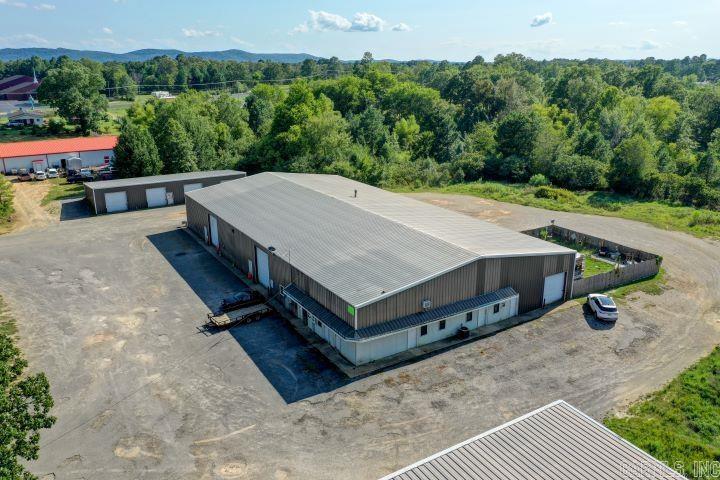 12,000 sq ft industrial building (80' x 150') containing 5 smaller individual warehouse spaces, and a small studio apartment. Also included is a detached 3200 sq ft building (40' x 80') containing 8 - 5x10, 2 - 20x25, and 1 - 40x50 storage units. Both buildings are separately metered. The main building was built to work on heavy equipment and has been used the last several years as an auction house. This property has unlimited possibilities and plenty room to expand on the 2.61 acres.