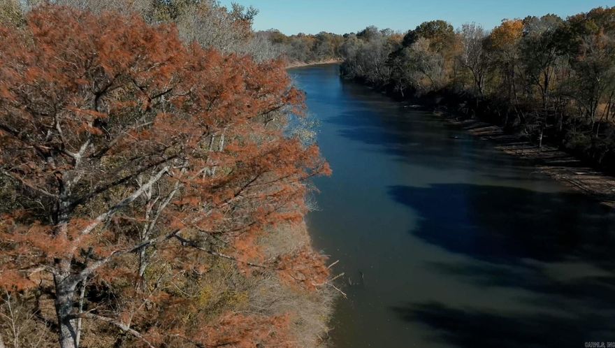 Welcome to the Red River 80, an exceptional 80-acre tract located along the scenic banks of the Red River just south of Judsonia, Arkansas. This unique property boasts approximately 0.7 miles of river frontage and sits only a stone’s throw from the Bald Knob National Wildlife Refuge—a premier destination known for world-class waterfowl, deer, and turkey hunting.  At the northern end of the property, buyers will find two mobile homes included in the sale, offering immediate use for a weekend retreat or transitional housing while building.  Formerly row-crop farmland and currently used for hay production, the Red River 80 provides versatility for agriculture, recreation, development, or investment. Whether you&#39;re envisioning a family homestead, creating a hunting/fishing camp, or exploring development opportunities, this tract offers abundant potential.  Located just minutes from Searcy in White County, this property perfectly balances rural tranquility with convenient access to town amenities—making it a standout opportunity in Central Arkansas.