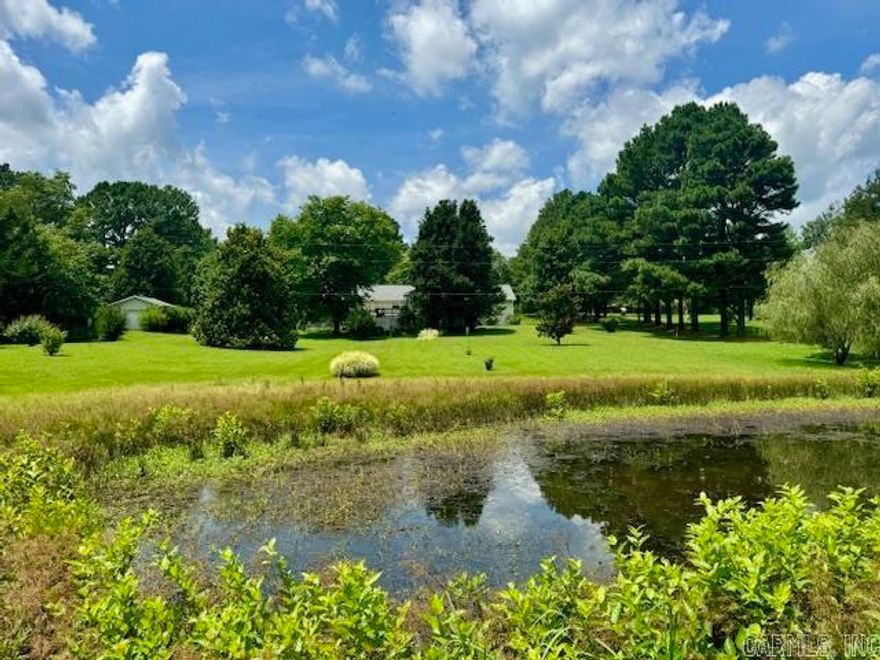 Discover country living just minutes from town with this beautiful 4-bedroom, 2.5-bath home nestled on 3.1 well-manicured acres at the end of a paved dead-end street—only 5 minutes from the Pocahontas city limits. Enjoy privacy, serenity, and the simple pleasures of life in a scenic setting that includes a picturesque pond and plenty of space to roam.  This thoughtfully designed home features an open-concept floor plan ideal for modern living, with spacious rooms that flow seamlessly for entertaining and everyday comfort. The primary suite offers a private retreat with an attached bath, while three additional bedrooms provide space for family or guests. A large addition currently serves as a family room with a gas log fireplace, vaulted ceilings and a sunroom overlooking the backyard, but offers flexible potential to be converted into a 5th bedroom or in-law suite.  Downstairs, you'll find a finished partial walk-out basement beneath the addition, great for storage or a storm shelter. With a private, park-like setting and easy access to town, this unique property offers the best of both worlds—country charm and city convenience. Roof replaced 2022.