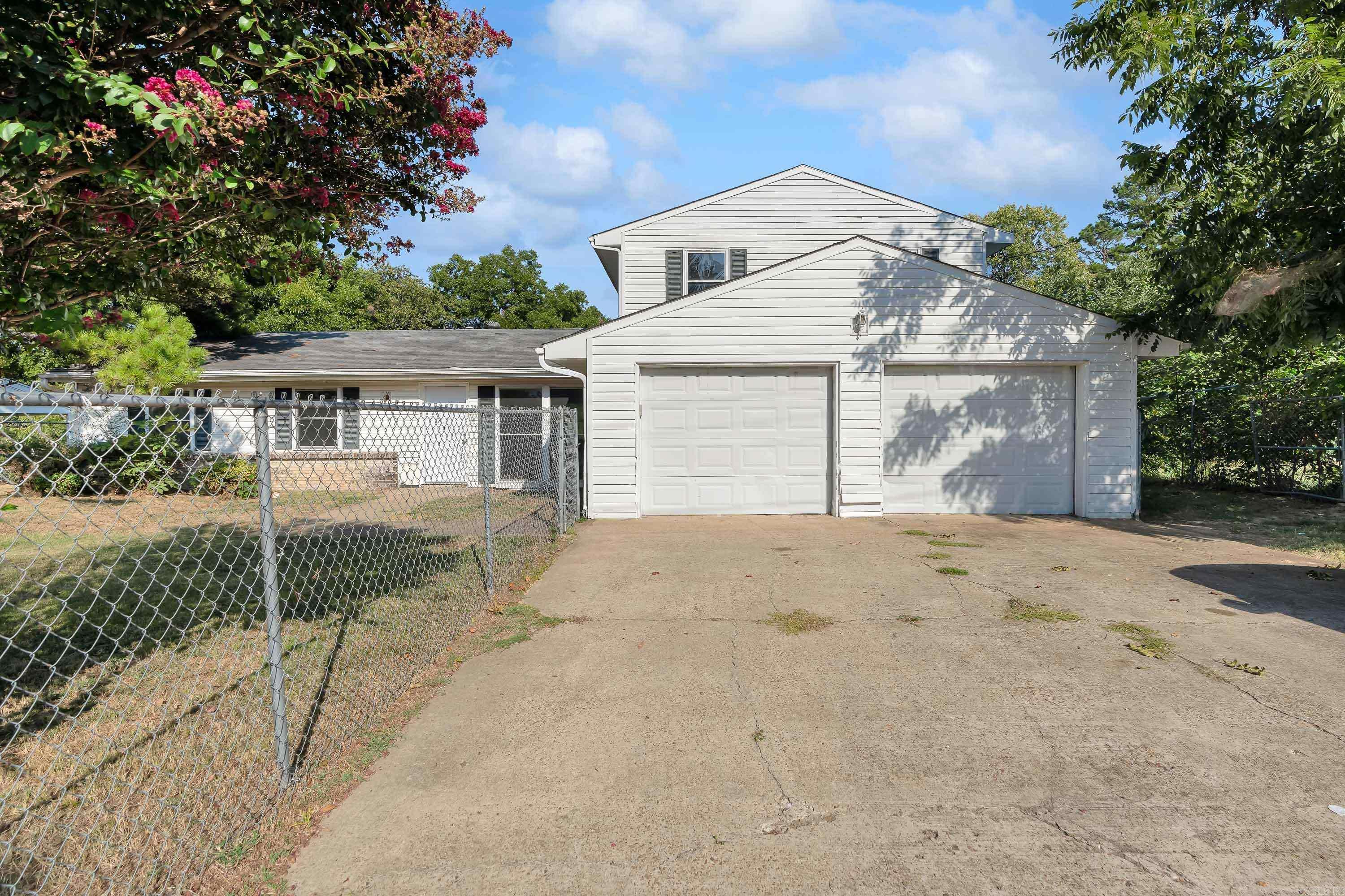 Welcome to 722 Kitchen St.! This spacious 3-bedroom, 2.5-bath home offers over 2,300 sq ft of comfortable living in the heart of Jonesboro. Step inside to find fresh paint, brand-new flooring, updated cabinets, and a refreshed bathroom that make this home truly move-in ready. The flowing layout provides two large living areas, a bright kitchen with plenty of storage, and a dining space that’s perfect for gatherings. The bedrooms are generously sized, including a primary suite with private bath. Outside, enjoy a sizable lot with room for entertaining, play, or gardening, plus a convenient two-car garage. With modern updates throughout and a central location close to schools, shopping, and dining, this property is a must-see. Don’t miss your chance to call 722 Kitchen St. home!