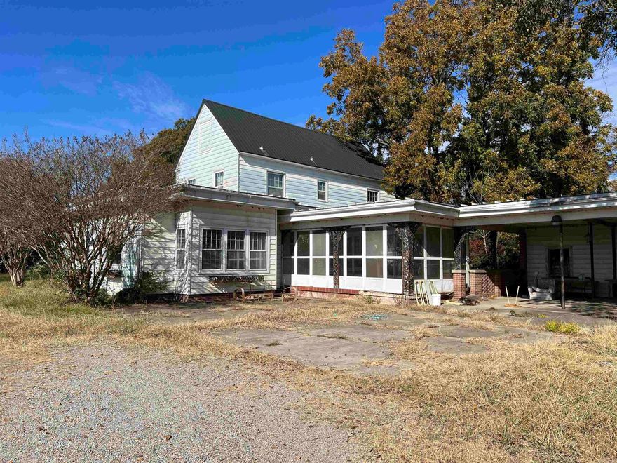 Spacious 4 bedroom 2.5 bath home sitting on 7 acres +/-.  The possibilities are endless and the home could be restored to it's original glory.  The property is sold AS IS.  Call or text today for more information!