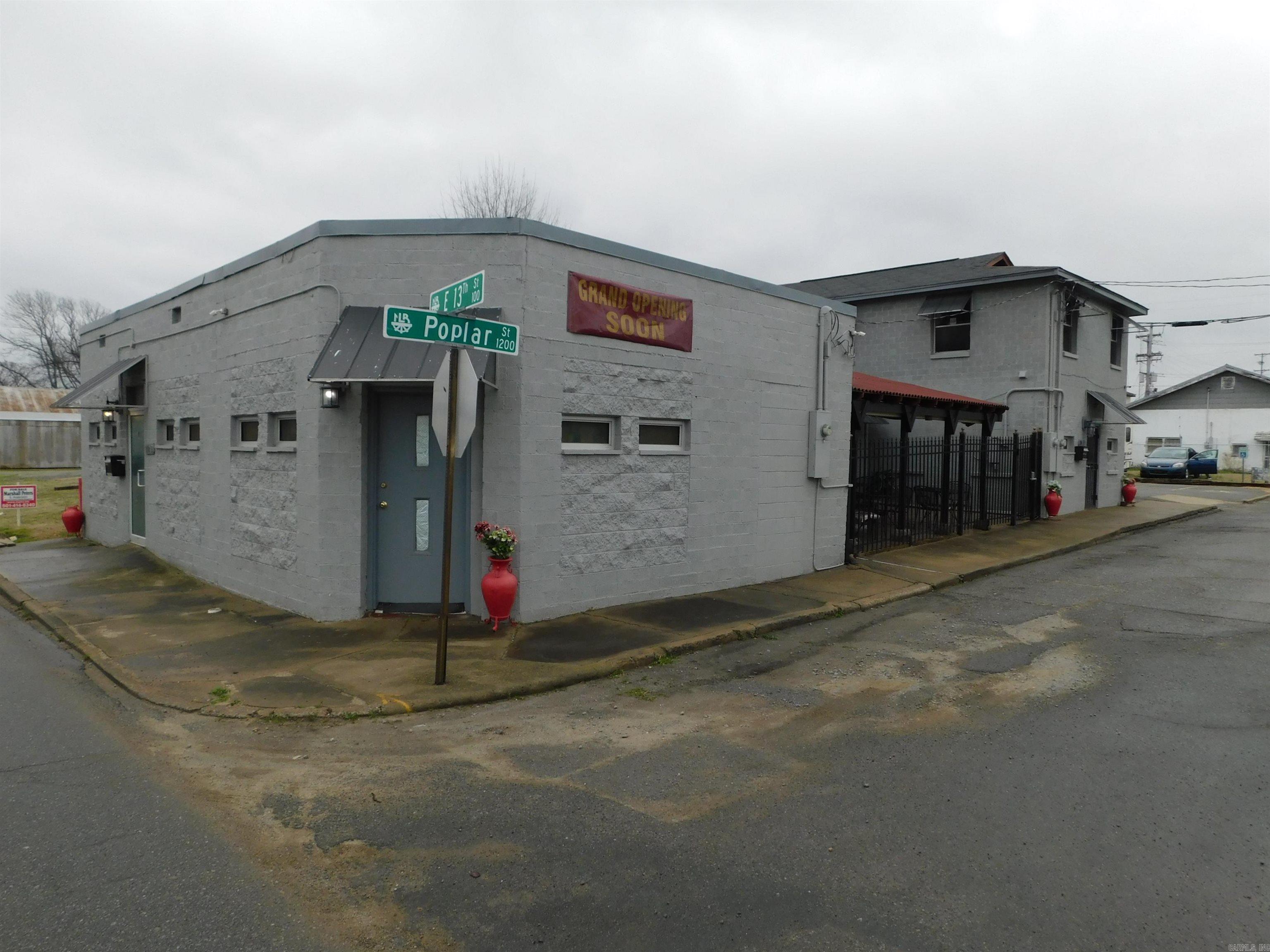 Restaurant building in a surging area of North Little Rock! Across the street from the new Central fire station being constructed. The building is divided into multiple use spaces with a restaurant, salon and a 1BR apartment which a future owner could occupy or convert into another use. Restaurant equipment including hood and fire suppression system to convey. The building sits on four lots and has 17 parking spaces with a storage unit and two covered parking spaces. All three spaces have a seperate entrance and security. There is a patio area for the restaurant that is enclosed with wrought iron fence. Could be great oppotunity for a restaurant owner or just as a rental. There is room for expansion on adjacent lot. Agents see remarks for showing instuctions.