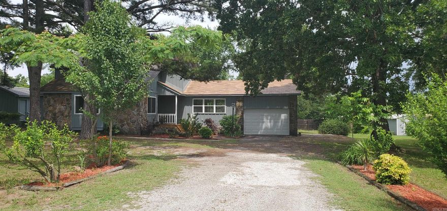 Take a look at this nicely remodeled 3-bedroom, 2-bath home with windows galore!  New, fresh paint inside and out. Original hardwood flooring in the living area. New laminate in other areas. Partial new roof. New central heat and air unit. New front doors.  New ceiling fans. New water heater. The kitchen has all new appliances, including a new sink, and a separate dining area. The primary bedroom is located downstairs, featuring an attached sun porch and a walk-in closet. The primary remodeled bathroom features a walk-in tiled shower, a new vanity, and a commode.  The remaining two bedrooms and a completely renovated bathroom are upstairs. Large, fenced back yard with a nice storage building with hardwood floors. Single-car garage with storage area.  Beautiful landscaping and a large yard. Call or text Kim Stewart 870-213-8698