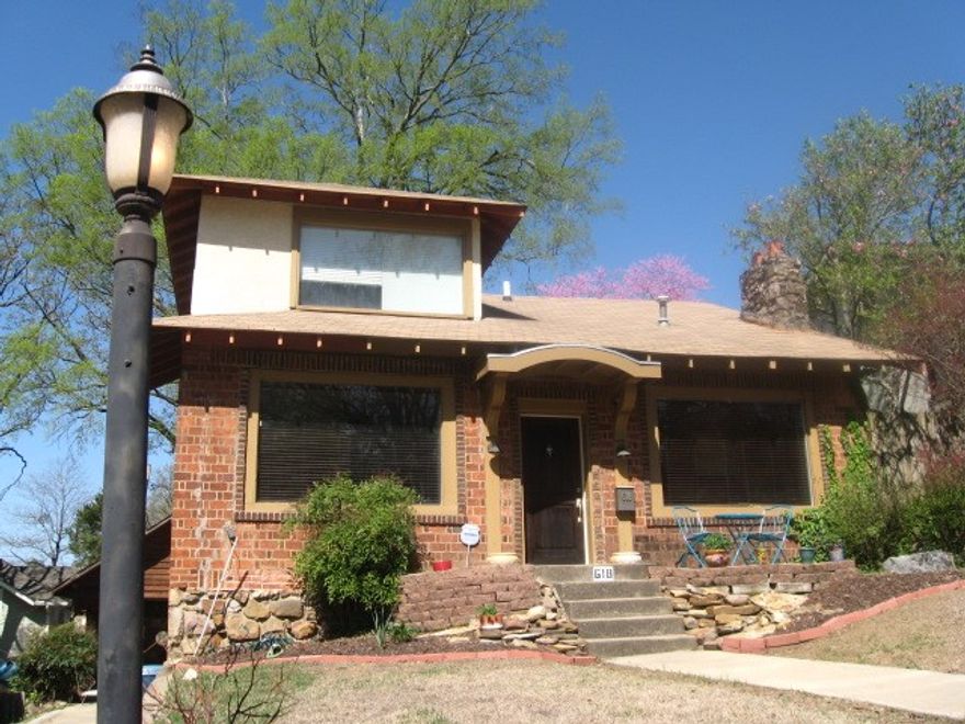 This totally updated HC home is in one of the most sought after locations in Hillcrest. Step out your front door into Beautiful Knoop Park w/views of the Skyline, State Capitol & the Arkansas River. This home features a Huge master suite w/ a attached office/nursery or 3rd bedroom. Both have walls of windows with tree top views. Walk-in closets. Two large bathrooms-Master bath has a over size shower and separate tub, downstairs bath has restored clawfoot tub. Sunroom w/wet bar & wine fridge. 350 sf basement