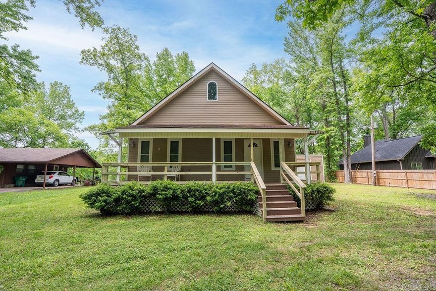 Discover your private river retreat on the majestic Little Red River in the heart of Heber Springs! This stunning 2,936 sq ft, two-story home sits on 0.65 acres in the desirable River Front subdivision, offering breathtaking river views & direct waterfront access. The home features 3 bedrooms & 2 full baths, perfect for comfortable living & entertaining. Step inside to an open-concept main level w/warm wbfp, luxurious vinyl plank/tile flooring & an eat-in  kitchen boasting a breakfast bar that includes ample cabinetry & modern appliances. The primary suite is conveniently located on the main level along w/2 guest rooms. Upstairs you’ll find a large game/bonus room that would be ideal for a home office, media room, game area or guest quarters. Outside, the possibilities are endless. Enjoy the expansive patio overlooking the river & covered front porch. The property includes an attached garage, storage building & a brand new private boat dock with a hoist/lift & covered slip—ready for fishing or simply relaxing by the water. Mature trees provide privacy & natural beauty. Turnkey riverfront gem delivering prime Arkansas living & unforgettable Little Red River Days.