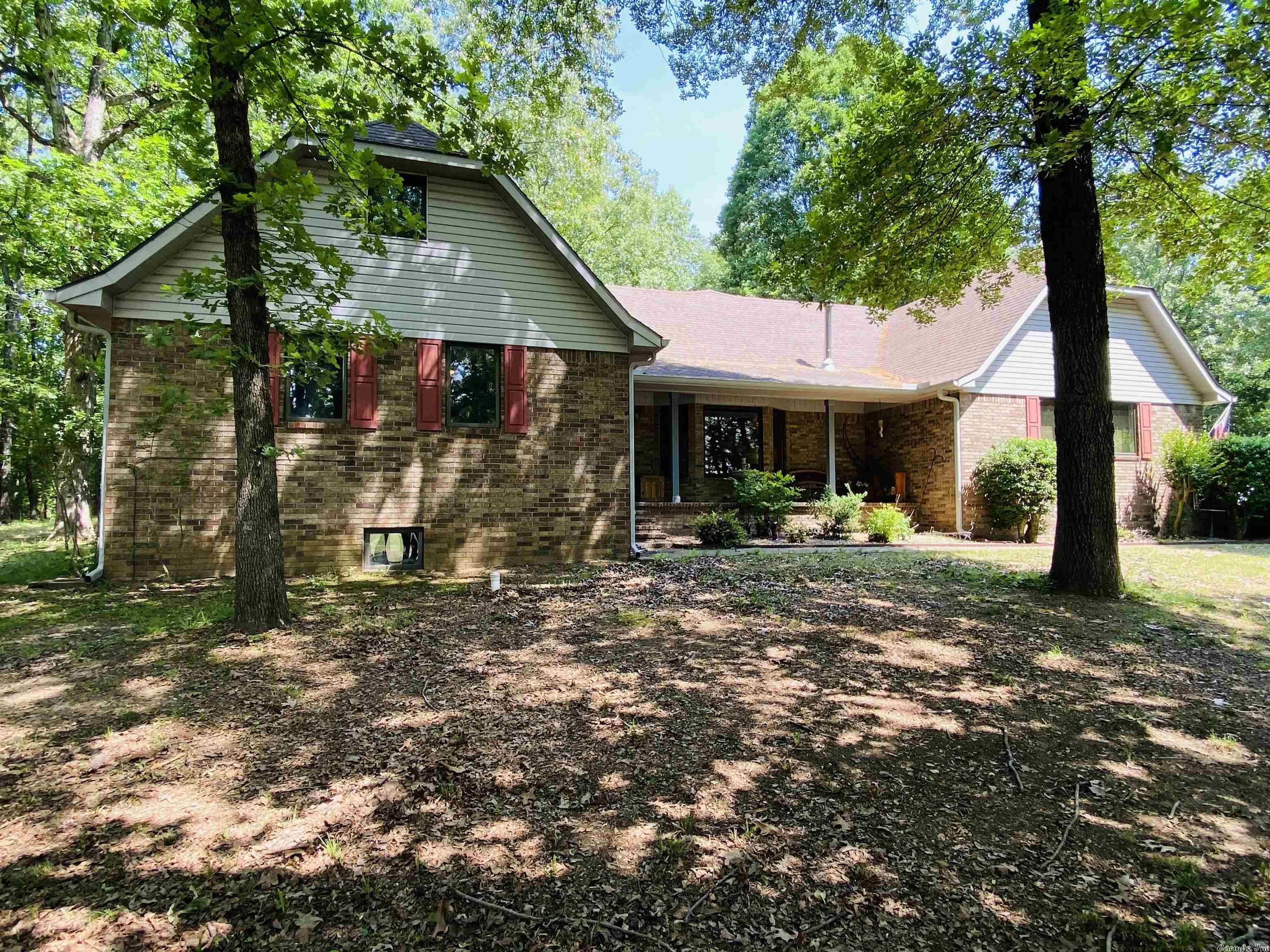 Welcome Home to this incredibly solid custom build w/so much space! Enter the 2nd level as the primary level (one above and one below). This home has cabinet and staircase work to amaze most people. The home site sits on approx 15-acres with a private pond, shop, & more! The home has key upgrades such as sunrooms, whole home generators, backup wood heat, new hvac, new mini splits, hot tub, newer kitchen appliances, master bath upgrade & more! The main floor boasts a large kitchen, two sun-rooms, eat in kitchen, large living room w/ soaring ceilings & tiger wood flooring. The master & a guest bedroom are off the main floor. Up the gorgeous wood stair case is a sprawling 2nd master bed & bath. Upstairs walk in storage on both ends of the home or future room enclosures if you desired even more rooms. Back downstairs go down into the finished basement & game room w/workshop & enormous safe room. So much to be seen! This home has a future story just waiting to be written! Also, 30+ additional pics available too! See Agent Remarks.