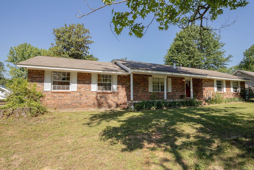 Adorable 3 bedroom 2 bathroom home on a corner lot! This well-loved home offers a warm and inviting layout with spacious living area and timeless appeal. The cozy gas stove creates the perfect focal point for relaxing evenings. Stainless steel appliances in the kitchen. Step outside to the covered back patio and fully fenced backyard perfect for kids and pets. This home is a great opportunity for buyers looking to add their personal touch while enjoying the benefits of an established property. Storage building to convey.