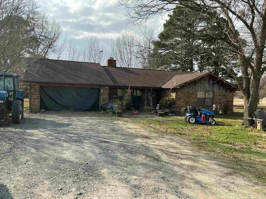 Rural location, paved road, mile to the city limits.  Some furnishings available to remain with purchase.  Garage is framed for door with no overhead door installed. Seller concession available for buyer assistance.