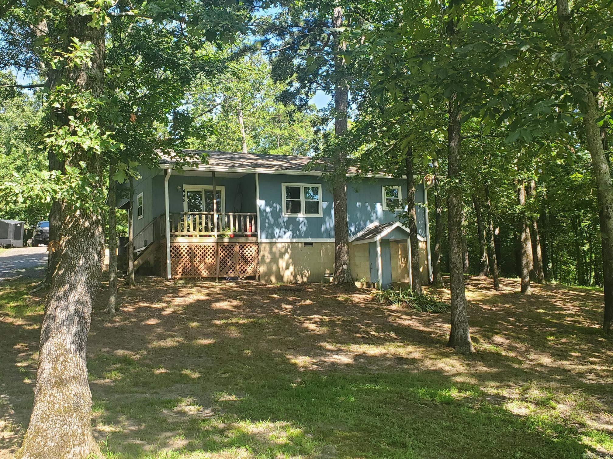 Discover your perfect retreat in this adorable 2-bedroom, 1-bath cottage located on a paved road just a stone's throw from Mena. With central heating and air installed in 2018, you'll enjoy year-round comfort in this cozy home. New roof 2025. Spacious walk-out basement for extra storage or recreational use. Convenient single carport for hassle-free parking A 12 x 20' storage building to accommodate all your tools and toys. Leaf guard gutters to keep your home maintenance low. Newer windows and doors, ensuring energy efficiency and updated style. All set on a generous 1.31 acres, offering room to roam and enjoy the outdoors. This charming cottage is the perfect blend of comfort and practicality, ideal for first-time buyers or anyone looking for a peaceful escape. Don’t miss out on this incredible opportunity to own a slice of paradise!