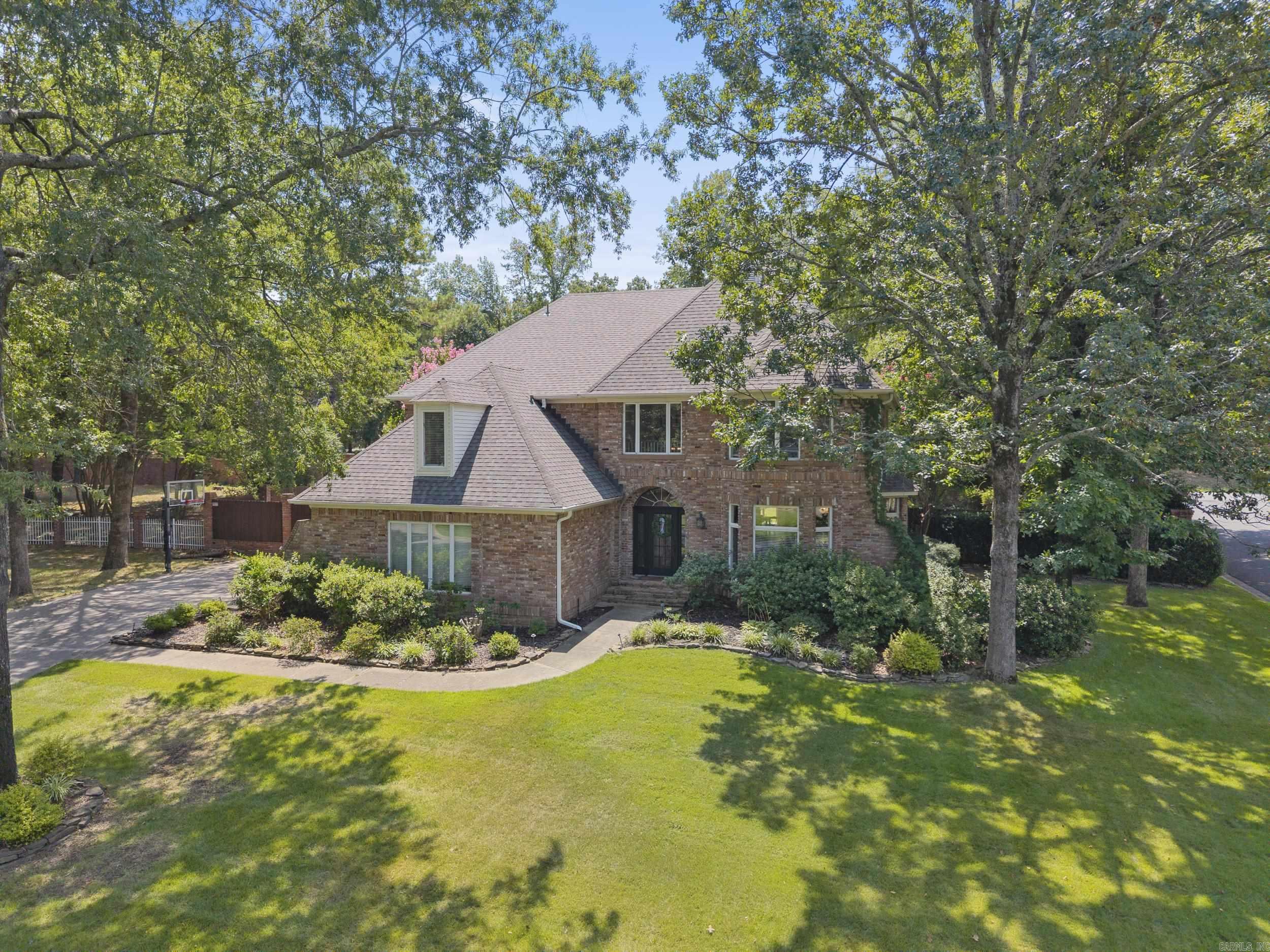 Custom home surrounded by mature trees and privacy in sought-after Pippinpost neighborhood! The backyard retreat features an in-ground pool with an 8' deep end, a covered stamped concrete patio, and historic brick walkway. The main floor showcases a two-story foyer with a balcony, hearth room, large kitchen with island seating, oversized dining room with a tray ceiling that easily seats 12+, as well as two sets of French doors leading into a second living room plus space for an additional eating area or game room. A dedicated laundry room with spacious pantry and a powder room round out the main floor. The second floor features the recently remodeled primary ensuite with a tray ceiling as well as a bathroom with a quartz dual vanity, soaking tub, and tile shower with a seat and shampoo nook. Additionally on the second floor are 3 sizable bedrooms and 2 full bathrooms including a second ensuite! The flooring throughout the main living areas and bedrooms was recently upgraded to a gorgeous, engineered hardwood which is easy to care for. Neutral paint throughout. Roof was new in 2022. Please reach out for additional information or to schedule a tour of this beautiful home!