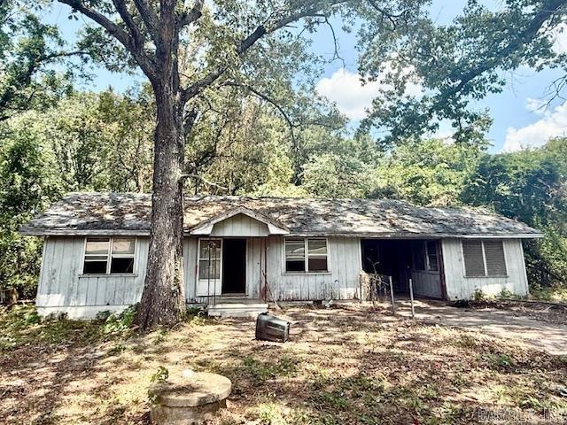 INVESTORS!!! Location/on an ACRE! Come use your Imagination on what can be. This home needs a complete gut job, but the bones appear to be good.