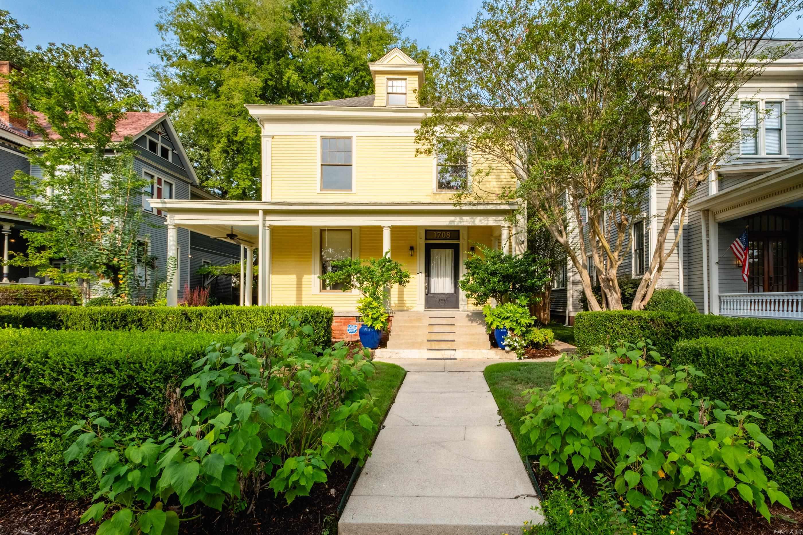 Located in the heart of Little Rock’s Governor's Mansion Historic District, this home blends classic southern charm with modern updates. A sweet front porch opens to a wide foyer with tall ceilings, handsome hardwood floors, and heavy pocket doors connecting the formal living and dining rooms. Freshly painted throughout, the main level also includes a sunroom, office with built-ins, convenient half bath, and a chef’s kitchen with abundant storage, Wolfe range, and open flow to the family room with fireplace. A huge vaulted screened deck overlooks a nicely landscaped yard and secure three car parking pad with wood gate and alley access. Laundry is just off the kitchen, with stairs leading to a basement ideal for storage. Upstairs, spacious light filled bedrooms share central baths, while the lovely primary suite features an updated bath, coffee bar, and second laundry area. This historic district location offers quaint surroundings and easy access to everything downtown as well as walking distance to SOMA. Come see!