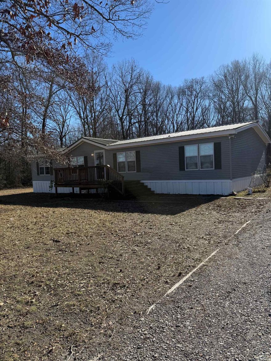 Over 3 acres with a ready to move in Mobile Home.  This home has been completely remodeled with sheetrock walls, luxury vinyl flooring throughout.  All kitchen appliances stay.  This 3 + acres is very nice and you have no restrictions.  call for your appointment