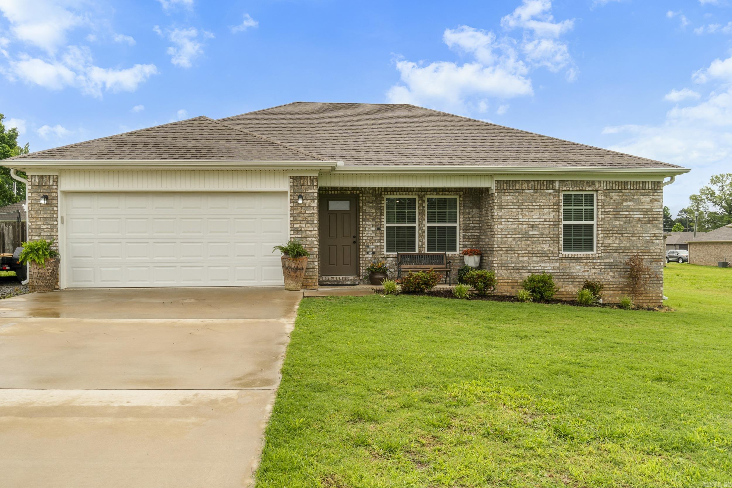 Welcome to 309 Dogwood St! This stunning home offers modern finishes, an open-concept design, and a spacious backyard with a covered patio—ideal for relaxing or entertaining. Nestled in a peaceful neighborhood, it’s the perfect blend of comfort and convenience. Schedule your showing today and make it yours!