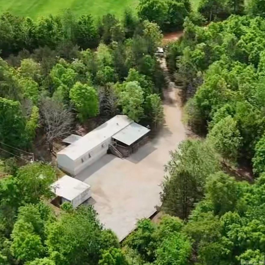 Tucked away in the scenic hills of Mountain View, this charming and private retreat offers the perfect opportunity for a cozy getaway or a high-demand Airbnb investment. Surrounded by peaceful woods, the property provides a true sense of seclusion while still being conveniently located less than 10 minutes from the White River—renowned for its excellent trout fishing. Outdoor enthusiasts will love the nearby ATV/UTV trails, making this an ideal escape for both adventure and relaxation. The home has been thoughtfully updated with all new appliances, including a washer/dryer combo unit, a new on-demand water heater (2025), an updated electrical box, and recent plumbing improvements—offering comfort and peace of mind for years to come. An extra-large gravel driveway pad provides plenty of space for parking or storing your RV or camper, and a Conex storage container conveys with the property for added convenience. Whether you're looking for a personal retreat or an income-producing property, this one truly checks all the boxes.