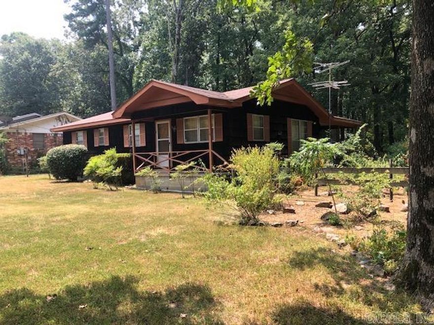 This is a one owner home.  It offers 3 bedrooms and 1.5 bathes. Bedrooms have large closets. The original hardwood floors in living room, hallway and bedrooms are in great shape.  There is a well on the property for watering a garden if desired.  The property also includes a storage shed and a separate large workshop.  The home is situated on a large shaded lot.  The home is being sold AS-IS. There is no SPD provided since sellers did not reside in the home. Please see Agent Remarks.