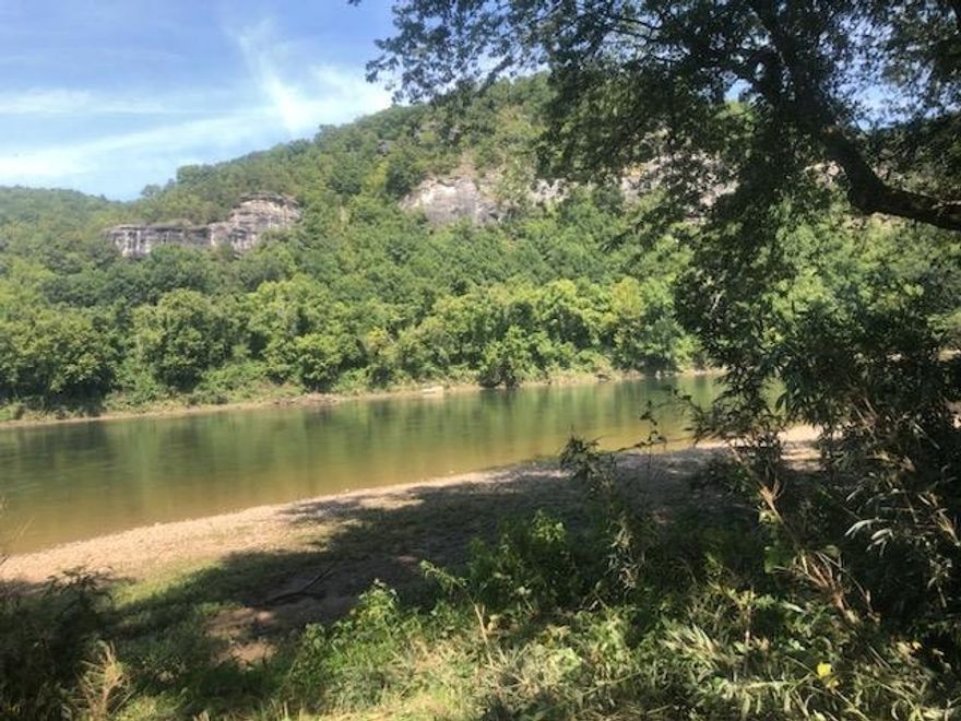 Here is a rare opportunity to own 4.19 acres of breathtaking riverfront with beautiufl views of the mountains and bluffs. This property offers a great get away or build your dream home. Elect., water and fiber optic already here.  Property also offers an old well, nice shade trees. Give us a call and let us show you the beauty and tranquility of this stunning river property.