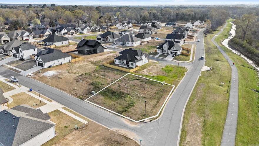 Perfect corner lot in sought-after neighborhood in Conway. In walking distance to newly renovated walking trail. Great neighborhood to build your dream house! All utilities ready to go. Lot restrictions of 2,200 Sqft minimum, home must have minimum 40% brick, rock, or cement coverage, and neighborhood provides cluster mailbox. Agents, please see attached documents for Bill of Assurance and Survey.