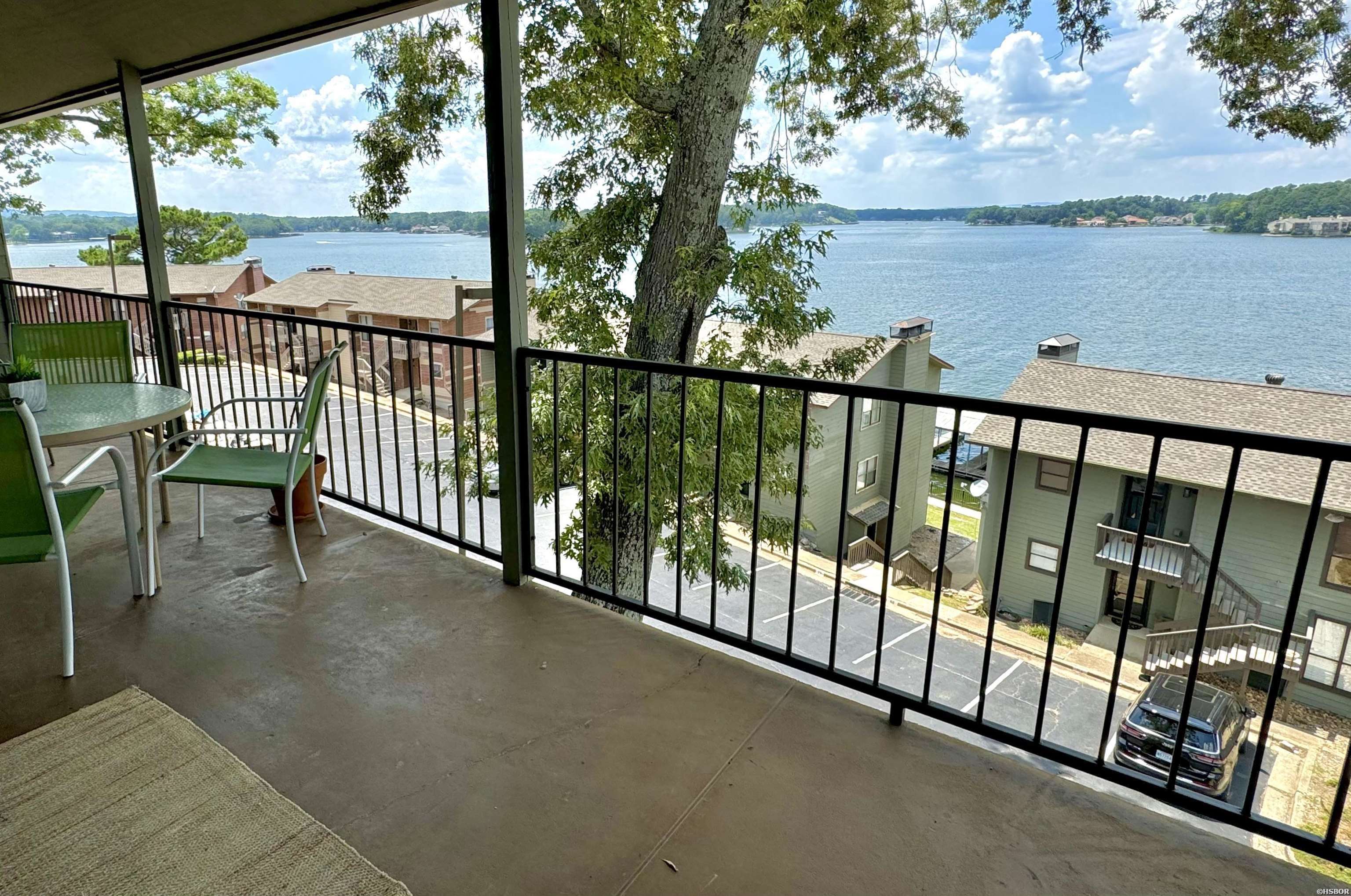 Beautifully updated Lake Hamilton condo with covered boat slip! The lake and mountain views from this 2BR/2BA condo are incredible. It's the perfect place to watch the holiday fireworks. Very convenient Hwy. 7 South location. All appliances and furnishings are included. Amenities include a gated entry, swimming pool, pickleball courts and pavilion down by the lake. Short term rentals are allowed in the complex, and this unit has a solid rental history.