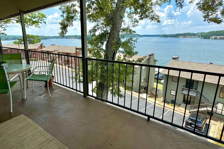 Beautifully updated Lake Hamilton condo with covered boat slip! The lake and mountain views from this 2BR/2BA condo are incredible.  It's the perfect place to watch the holiday fireworks. Very convenient Hwy. 7 South location.  All appliances and furnishings are included.  Amenities include a gated entry, swimming pool, pickleball courts and pavilion down by the lake.  Short term rentals are allowed in the complex, and this unit has a solid rental history.