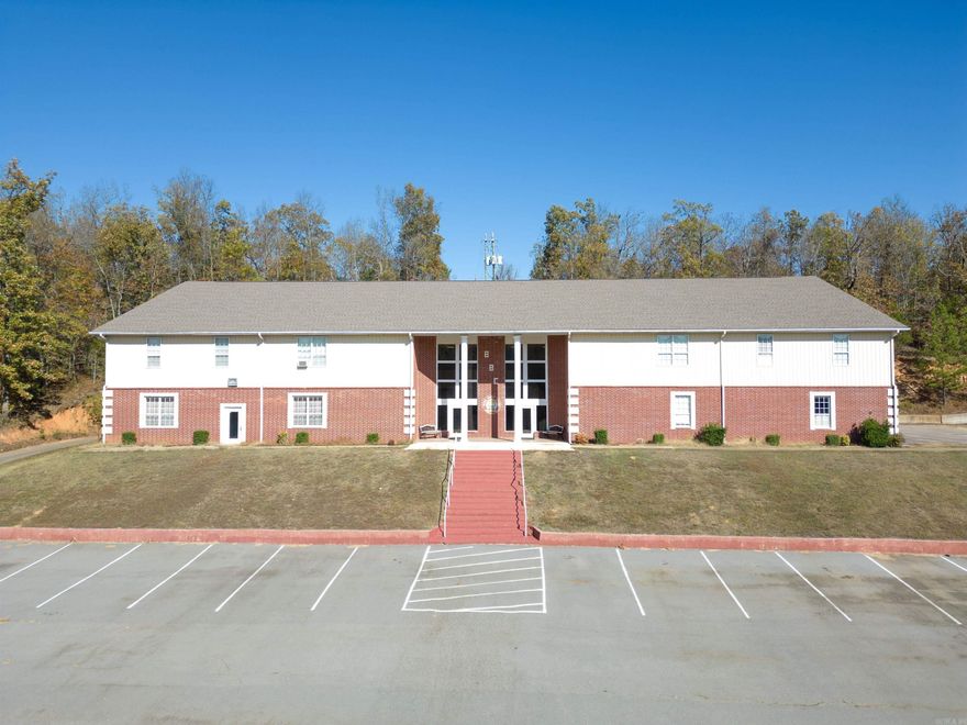 UNIQUE PROPERTY WITH LOTS OF POTENTIAL!  Peaceful AND gorgeous acreage with small lake and 2 large buildings formerly used as college/camp dorms--one has large meeting area with a working industrial kitchen. some over the water cabins would be a great income producing possibility.   Great opportunity for an event center, retreat, school, camp, spa, or a wonderful homestead--just use your imagination!  The property is being sold as-is and with some inventory left in place!  Some TLC needed in older building and cabins. Other amenities include rec room, pavilion on the lake, basketball court, potential to add more cabins on the lake, two sheds and much more. Expenses are utilities only.  Must be accompanied by listing company. Mobile homes and lawn equipment do not convey; mobiles will be removed.  See agent remarks.