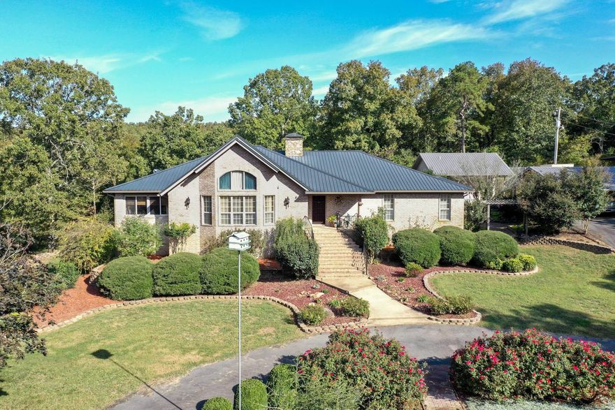 MUST SEE: Beautiful 3bed 2bath one level home with approx. 8 acres that feels like a retreat and is situated comfortably between Beebe & Searcy. This home has been meticulously maintained inside and out and offers more than you can fit on one page! When you enter the gated driveway the first thing you notice is the picturesque landscaping inviting you toward the home. The front door of the main house welcomes you into the spacious living/dining combo perfect for family nights or entertaining guests. The large, gourmet, eat in kitchen with an oversized island and access to the sun/game room is where you will catch your first glimpse of the oasis that is the backyard. Including a brand-new deck and patio, you can envision perfect outdoor meals and reading a book in the serenity of this quiet, inviting space. Back inside, be sure to check out the enormous primary bedroom with an electric fireplace, oversized tub, and walk in closet.   Don't miss the 800 sq ft guest house complete with laundry, kitchen, and bathroom that is perfect for visiting family or income producing rental.  Other features are a 15x30 shop with garage door entry, 8x10 garden shed, and metal chain link dog pen.