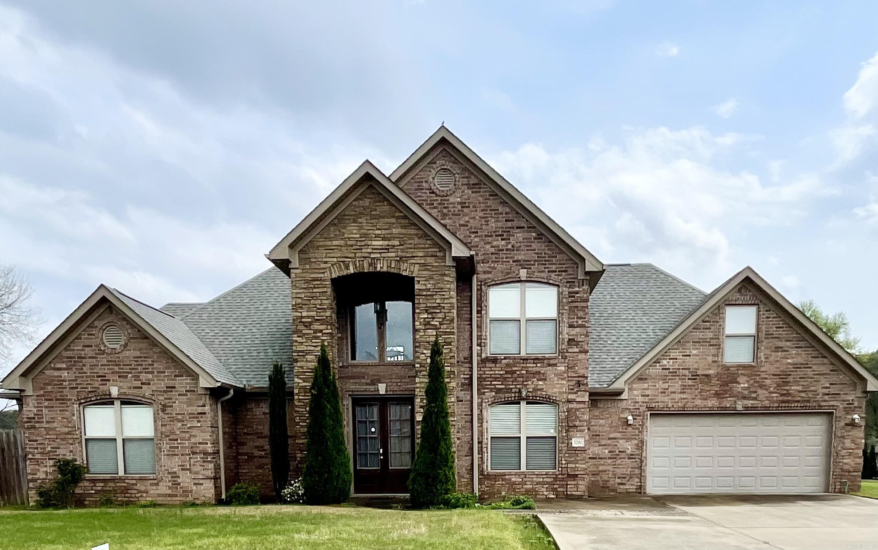 Welcome to this stunning 2-story brick home nestled on a generous corner lot in the heart of Bryant. Boasting approximately 2,787 sq. ft. of well-designed living space, this home offers 4 spacious bedrooms, 2.5 bathrooms, and a large bonus room above the garage—perfect for a playroom, home office, or media space. Step inside to a grand entry with soaring ceilings that set the tone for the elegance throughout. The main living areas feature brand-new luxury vinyl plank flooring (08/2024), while the kitchen is a chef’s dream with granite countertops and plenty of workspace. Upgrades include new paint throughout the home's interior and a new roof in August of 2024. An oversized 2-car garage has room for storage and/or a work area. The large covered back porch is ideal for relaxing or entertaining. Located in a desirable area of Bryant, this home blends space, comfort, and functionality —don’t miss your chance to make it yours! SHOWINGS AVAILABLE BEGINNING: Monday, April 21, 2025. Call me and let's get your private showing scheduled today!