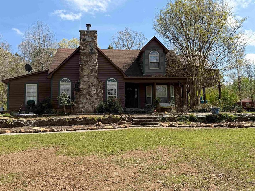 Welcome to your private country retreat! Nestled on 2.33 beautiful acres, this charming 2,410 sqft two-story home offers the perfect blend of comfort, space, and functionality. Step inside to a warm and inviting living area featuring a stunning floor-to-ceiling stone fireplace and abundant natural light. The home offers 3 spacious bedrooms and 2 full bathrooms, with a thoughtfully designed layout—guest bedrooms located downstairs and a private upstairs master suite. The oversized master retreat includes direct access to a screened-in sun porch, perfect for relaxing mornings or peaceful evenings. The en-suite bathroom features a jacuzzi tub, separate walk-in shower, and generous walk-in closet space. Downstairs, you’ll find a large bonus room ideal for a second living area, game room, or home office. The additional full bath also includes a jacuzzi tub/shower combo for added comfort. Enjoy the outdoors from two upstairs sun porches, including one screened-in for year-round enjoyment. The expansive property offers plenty of room to roam, entertain, or expand. A major bonus—there is already a 40’ x 50’ plumbed foundation in place, ready for a future shop or garage.