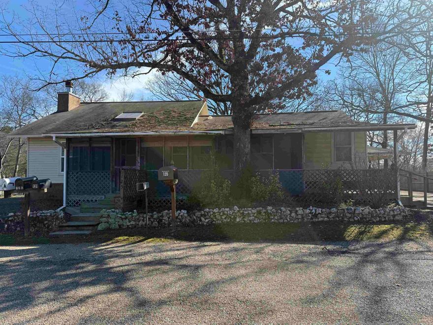 Investor special! This property is a modest family home with potential rental income and outdoor living space, situated in a rural area of Hot Springs with minimal traffic on a dead in street. Large living area, lots of storage, laundry room, screened in porch. The additional mobile home adds flexibility for guests, mother in law quarters, extra storage or rental income. Three bedroom two bath in main living home, mobile has 2 bedroom 1 bath. Nice yard area.  Needs updating and repairs but will make a great addition to your portfolio. Lake Hamilton Schools.