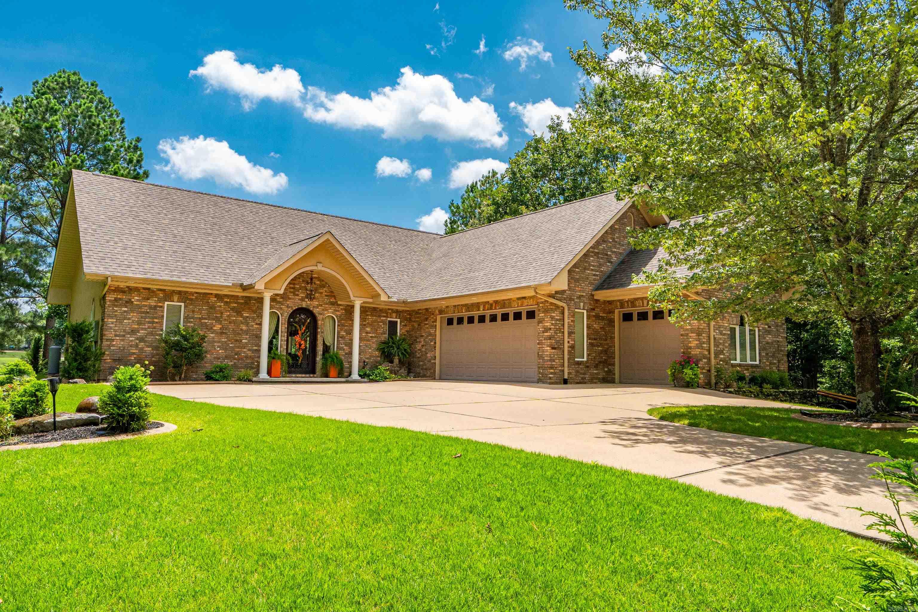 There are homes that are on the golf course, and then there are homes that are ON THE GOLF COURSE!! This lavish Granada Golf Course home boasts a view of Lake Granada, the #8 tee box and within speaking distance of golfers sinking putts on the par 3 green below. From the luxurious real wood floors throughout, amazing open kitchen, beautiful light fixtures, to the waterfall flowing in the back yard towards the green, and oversize garage with a third garage door for your golf cart, this house screams luxury from every corner! The course-facing covered back patio has an outdoor TV, hardline gas grill connection, and electric awning to shield you from the evening sun while the steaks sizzle and you watch the big game! Other features include wide doorways for wheelchair access throughout, a pantry the size of most kitchens, separate office/laundry room, gas fireplace, and Old Glory dancing in the breeze between you and the golf course. New roof in 2023. There is a $2,000 POA buy-in for first-time HSV buyers. Please see Agent Remarks for more information.