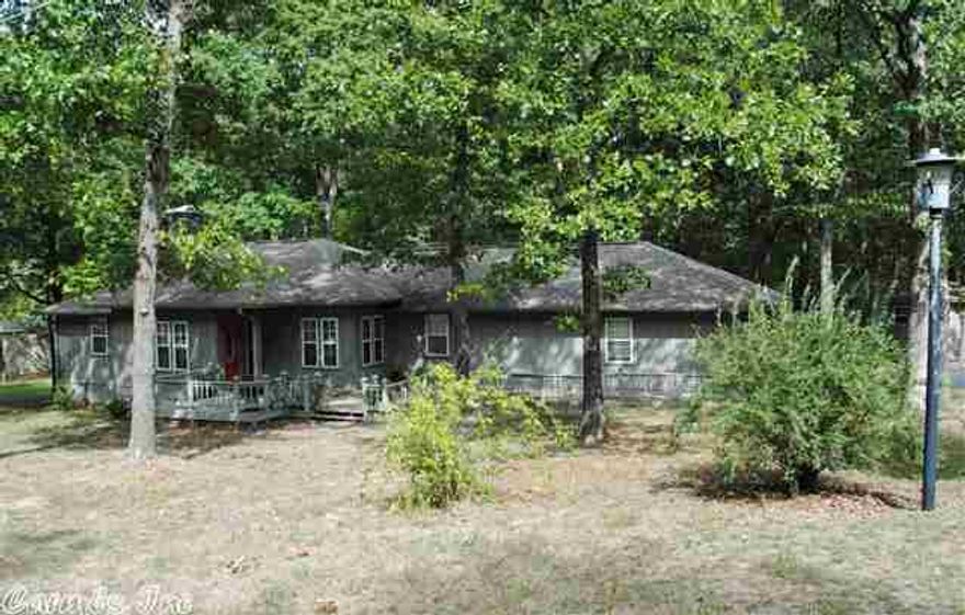 Great home with two lots in Tumbling Shoals.  Close to the lake and river and only 10 minutes to down town.  Well maintained home with very nice kitchen with lots of cabinets.  Over sized garage with room for your boat and truck.  Enjoy the outdoors from the screened in porch off the master bedroom or from the large front deck.  The home is handicap accessible.  There is a detatched single garage/shop and a RV or pontoon boat cover too.