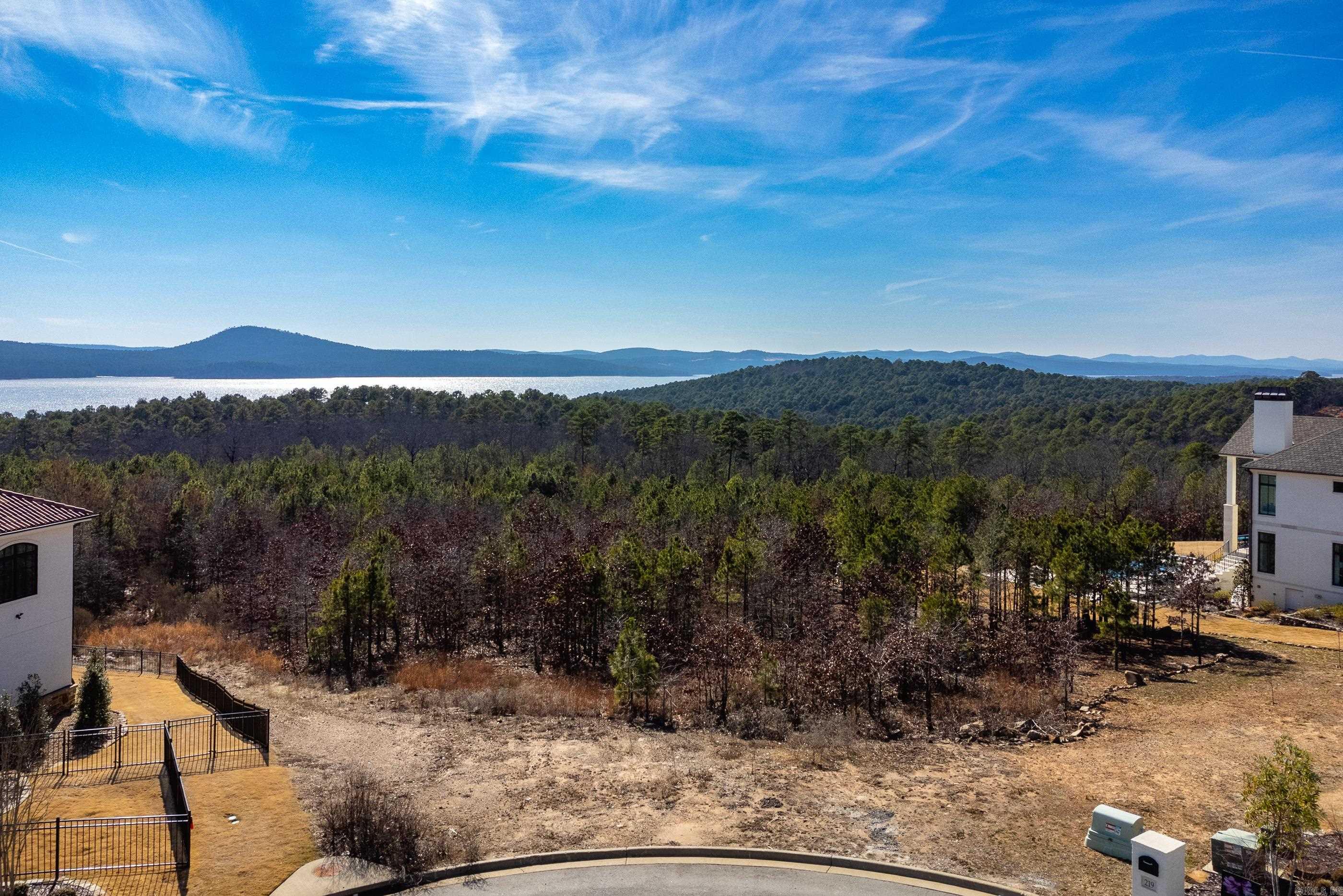 If you like a phenomenal view and to have front row seats to spectacular sunsets, this is the lot for you. Last lot available on this sought after street. Build on this lot and enjoy a view of Pinnacle, Maumelle Lake, and serene mountains all with in a gated neighborhood.