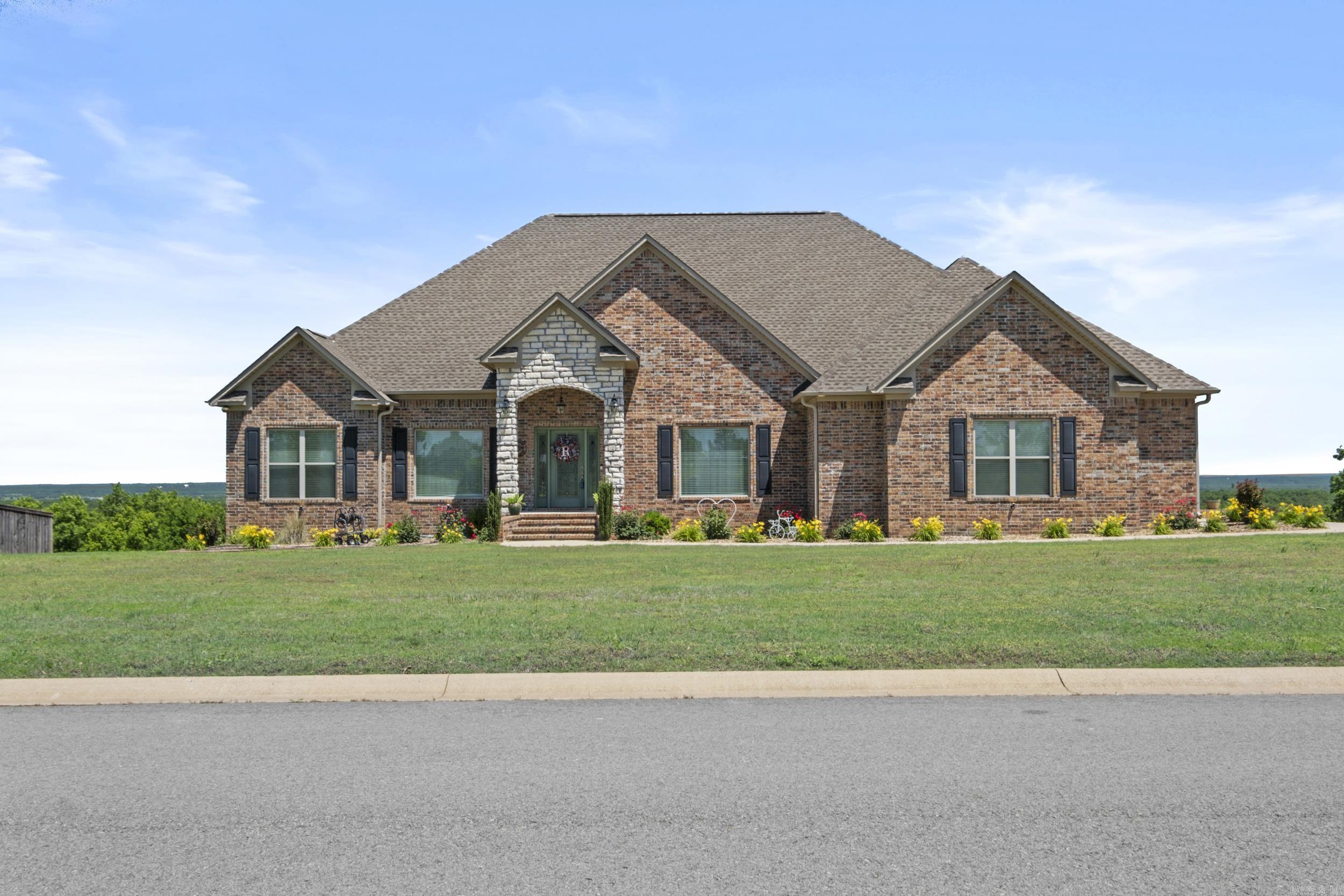 Stunning 4,100 SF custom home in a gated community with views of Seven Point Lake and scenic natural surroundings! Energy-efficient and built for entertaining, it features an open layout, gourmet kitchen, formal dining, vaulted great room, and a spacious deck. Includes 4 bedrooms, each with a private bath, ample storage, and a walkout basement with second living area and full bath. Situated on 1.06 acres with a 2-car garage plus a separate basement-level 1-car garage. Enjoy fishing, kayaking, and walking/riding trails around the 22-acre community lake. Check out the virtual tour!