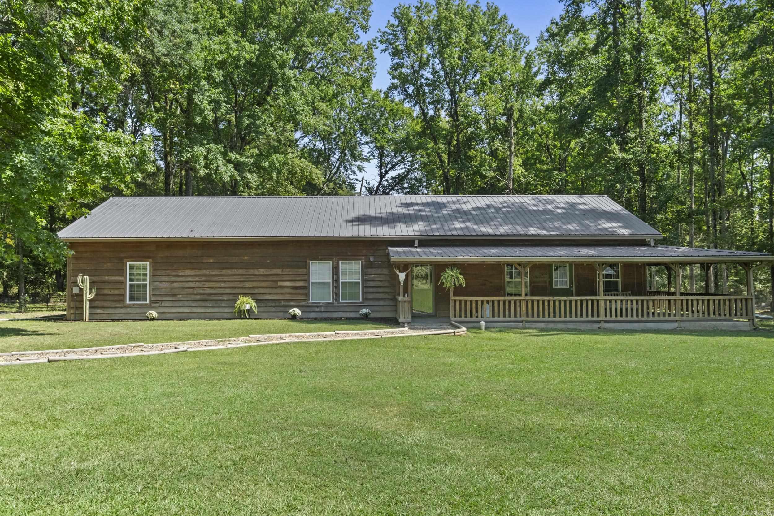 Perfect Little Slice of County Living!! This 4 Bedroom, 2 Bath, Ranch Style Home sits on 1.37 Comfortable Acres in the sought-after Cabot School District! Inside you'll find plenty of updates and an Awesome Floor Plan Featuring a Huge Great Room with Great Lighting and tons of Detail! The kitchen offers Granite Countertops & tumbled Backsplash, a Cozy Dining Area with Sliding Barn Door, Custom Lighting Fixtures, and Large Walk-in Pantry! The Split Master is Tucked away for privacy & separate from the Oversized spare bedrooms & main living area. The Laundry is good size and home has lots of extra Storage throughout! Outside, enjoy a Recently Built 25x30 Shop-ideal for Hobbies or even a small business- and Barn with Electric, Water, and Dog Kennel. You will fall In Love with the Wrap Around Covered Porch complete with Swing to enjoy morning Coffee & Nature at it's Best! Livestock Allowed! New HVAC in 2023!