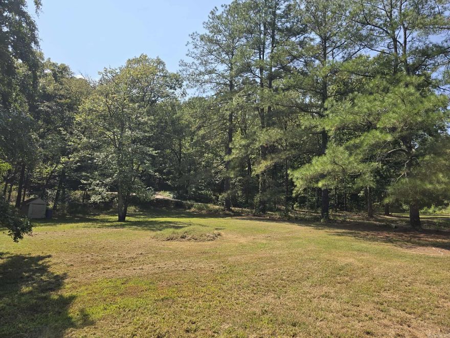 This is prime property. Off of Sunshine rd, borders hundreds of acres of National Forest on two sides, dead end road, and only a few minutes from Lake Ouachita. A hunters paradise! There is a dwelling currently on the property. It single wide mobile home with a 2-story addition added on to it. It needs a lot of work and is not livable in its current condition.Tear down and build your forever home. It would be hard to find better land and location than this! Owner is a licensed real estate agent in the state of Arkansas