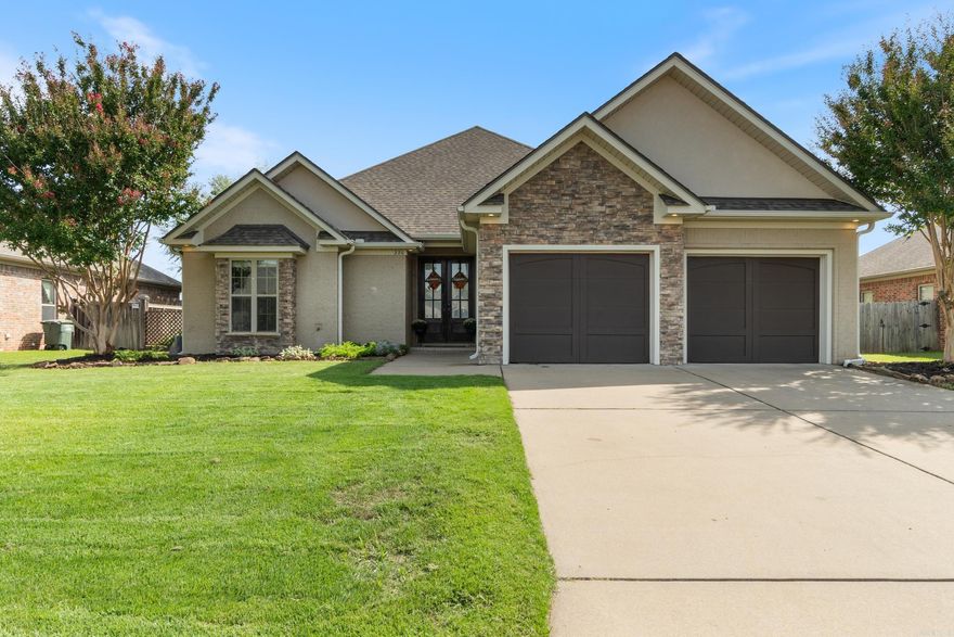 This beautiful home offers comfort, functionality, and thoughtful details throughout. The spacious layout offers 4 bedrooms, 3 full baths, and 2,322 sqft of living space. The kitchen has granite countertops, wall oven, gas cooktop, pull-out cabinetry, and a brand-new dishwasher. Oversized laundry room with storage & built-in ironing board. The primary suite has an exterior patio access, large closet with built-ins, jetted tub, and a standalone shower. Two bedrooms on the main level plus a private upstairs bedroom with its own bath -- perfect as a guest suite, bonus room, or office. Beautifully landscaped backyard with multiple trees and a french drain system and side yard with garden area, irrigation system, and timer-controlled watering. Recently added is a 16x12 heated and cooled flex building -- idea for a studio, gym, or hobby space. This property combines modern convenience with flexible living spaces -- ready to welcome its next owner. SHOWINGS BEGIN 10/02/25 *PLEASE SEE CONFIDENTIAL REMARKS*