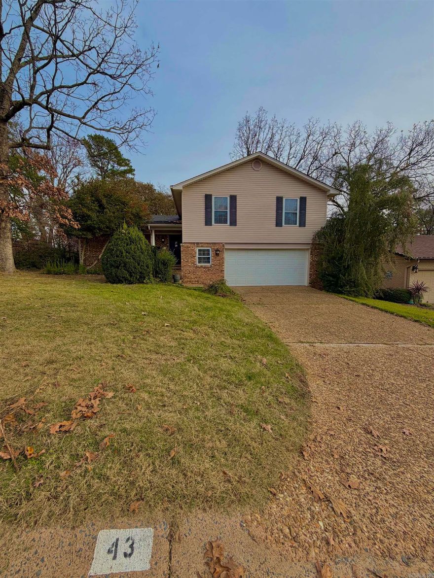 Located in a quiet, family-friendly neighborhood, this inviting home at 43 Colony Rd in Little Rock offers comfortable living with thoughtful updates throughout. The property features two spacious living areas, providing flexibility for family life, a playroom, or a home office. A dedicated mini bar area adds a unique touch for entertaining. Enjoy outdoor living in the beautifully landscaped backyard, complete with a brand-new deck and a covered back patio—perfect for relaxing, grilling, or hosting family and friends. This well-maintained home offers both indoor versatility and outdoor enjoyment. Architectural shingle roof new in 2023. Deck new in summer 2025.