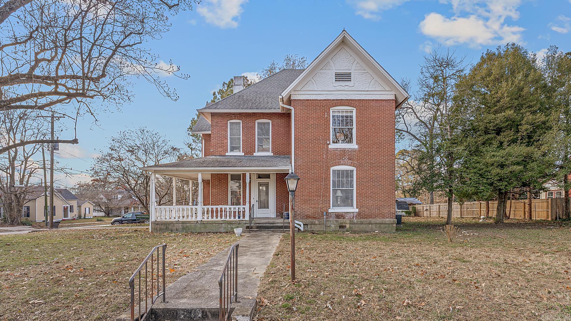 Nestled in the heart of the charming West End district of downtown Jonesboro, this beautifully preserved historic home invites you to experience timeless allure. Dating back to the turn of the 19th century, this property once belonged to the esteemed A.M. Love family and is a testament to enduring craftsmanship and character. This two-story gem boasts 3 spacious bedrooms, 2.5 baths, and three versatile living/sitting areas, offering plenty of room for family gatherings and quiet retreats. The stunning original hardwood flooring and two fireplaces infuse warmth and historic charm into every corner of the home. Situated on an expansive .33 acre lot, this property offers ample outdoor space for gardening, entertaining, or simply enjoying the tranquility of a bygone era. From its rich history to its meticulous architectural details, this home is a rare find. Don’t miss your chance to own a piece of Jonesboro history in this coveted neighborhood! Schedule your private tour today. Agents please see additional remarks.