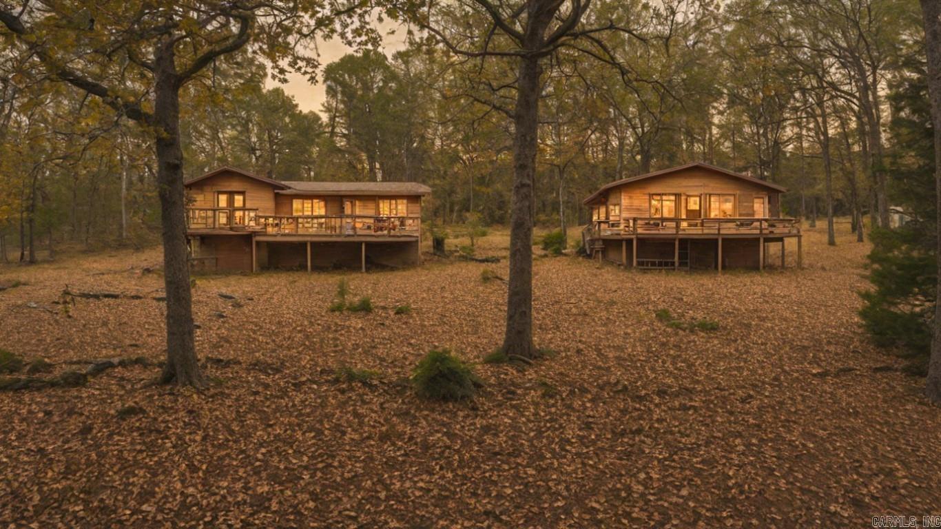 Here's your chance to own not one, but two cozy lake cabins on 2.3 secluded acres near Heber Springs Marina (just 1.8 miles away)and only 15 minutes from Little Red River! Welcome to 244 and 250 Wanda Lane! This unique property offers incredible potential as a vacation rental or a peaceful getaway for family and friends. The first cabin features 2 bedrooms, 2 bathrooms, a spacious walk-out basement for storage, and a large deck overlooking the scenic surroundings. The second cabin is also a 2-bedroom charmer with 1 bathroom and a spacious deck, perfect for relaxing views. Both cabins include wood-burning fireplaces, adding warmth and ambiance during fall and winter. Don't miss this rare opportunity to own a beautiful slice of Greer's Ferry Lake! Call me today to take a look at these amazing cabins!