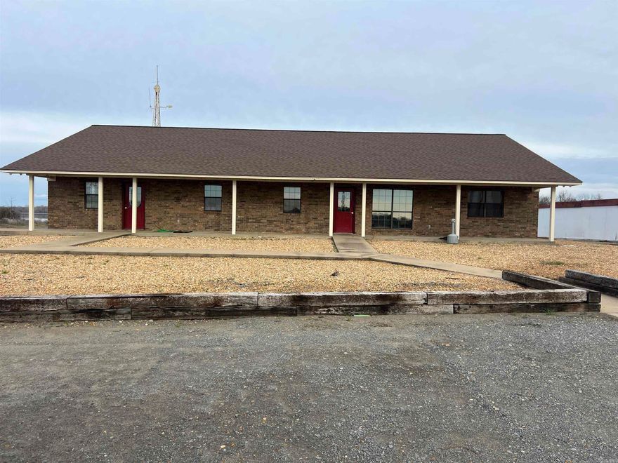 Parcels to convey are 001-05230-000 & 001-05229-000 This 31 acre property located on the banks of the Arkansas River has great industrial potential The fully fenced property has a 2800 sf office building with 4 office spaces, 2 bathrooms, and a breakroom.  The width and channel depth of the Arkansas River allows fleet loaded hopper barges to be loaded and unloaded on the loading dock has been approved by the Corp of Engineers.  There are 12 anchor points all along the river frontage that also has been approved by the Corp. and is currently being leased and earning monthly rental income.  Full size line boats are able to travel up and down this area without an issue.  There are two steel covered areas currently being used for material storage, a service garage, paint shop, storage building, 1000 gallon fuel tank, propane tank, 1000 gallon oil pump/storage station, steam cleaning station, 2 flammable storage containers, and another storage container.  This property has great potential and is currently listed below appraised value.