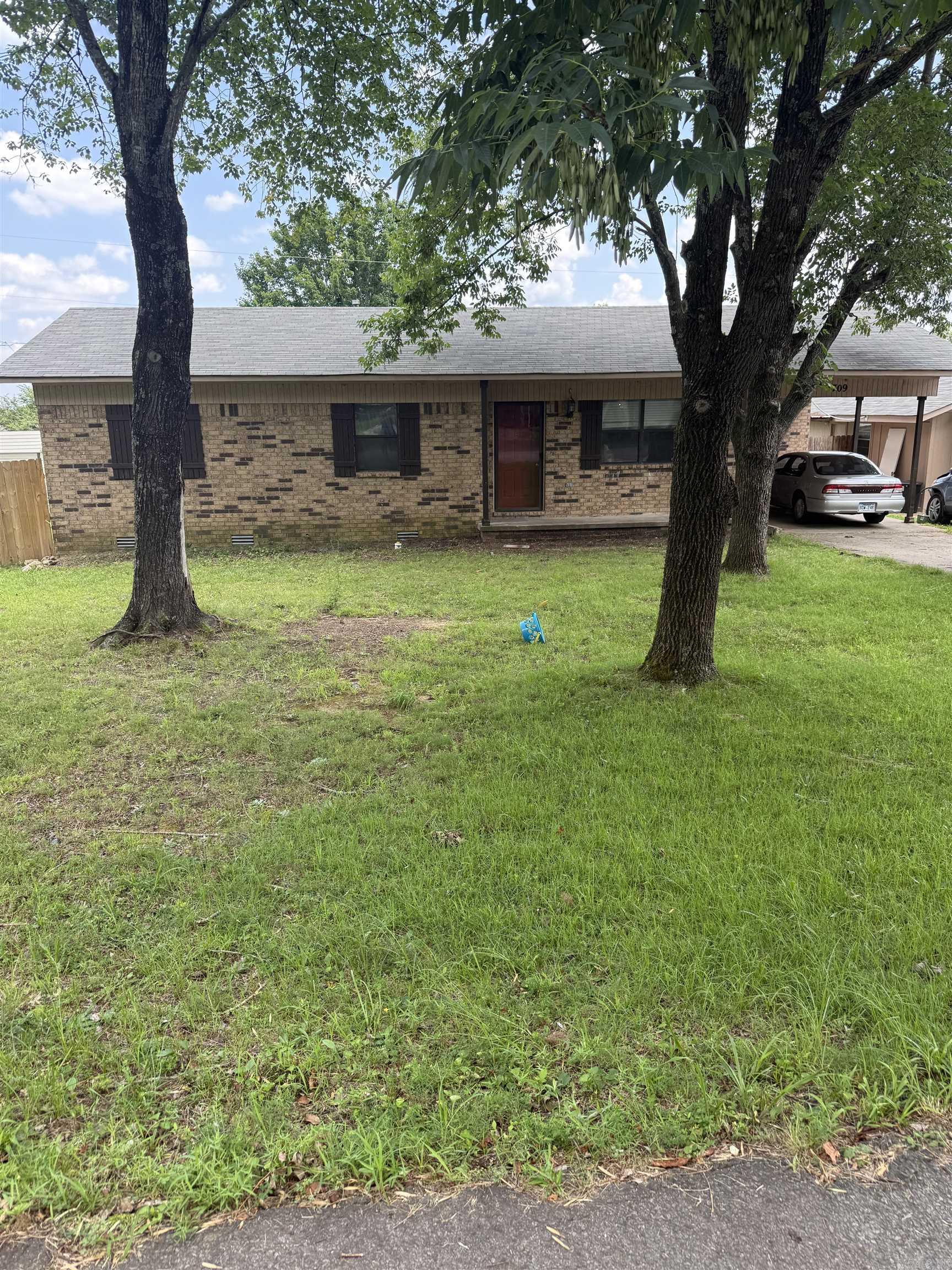 3 bedroom, one and a half bath on a nice size lot with fenced in back yard. An additional apartment or mother in law quarters with covered parking. Also included 8 by 12 storage building.