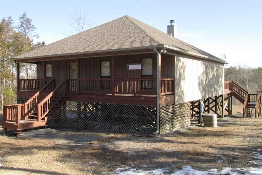 Fantastic 4BR, 2BA LAKEFRONT home. Home features large wooden decks on the front and back, with Greers Ferry Lake easily accessible from the back yard.  The home was built in 2004 and has a beautiful wood-burning fireplace.  This is the perfect place to have a cup of coffee on the back deck while looking out over the water.  It has all the tranquility of country living, as well as the convenience of immediate lake access.  Great for a summer getaway or permanent home on the lake.