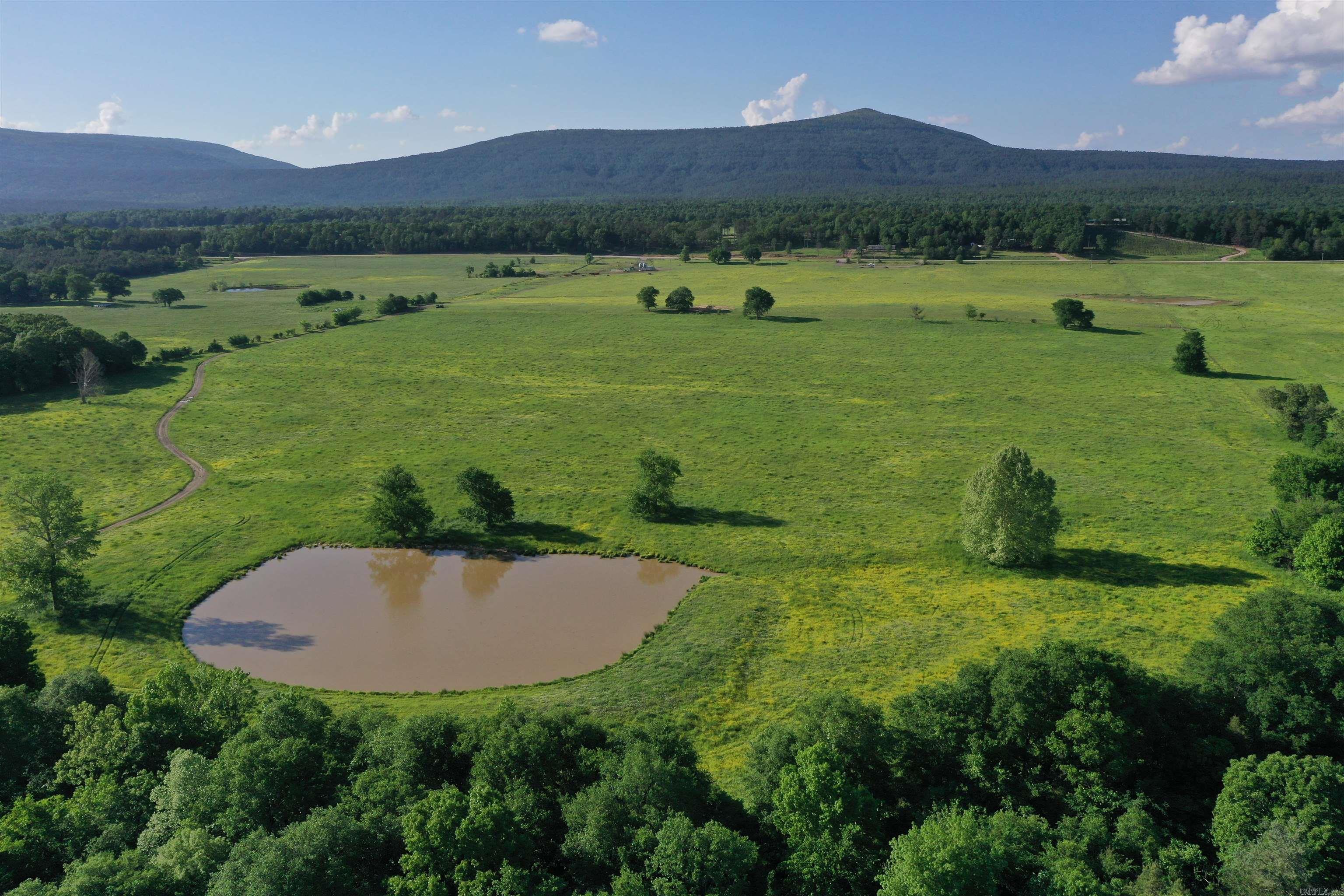 ⢠221 +/- acres ⢠190+/- acres of fenced pasture ⢠1 Mile of Poteau River Frontage ⢠Cross Fenced into four pastures ⢠Corral with New Arrowquip chute and scales ⢠Two Feed bins for cattle feed ⢠Multiple traps for holding cattle at corral ⢠Fenced alleys between pastures for moving cattle ⢠Frost Free cattle drinkers ⢠Electricity and Rural Water on property ⢠Excellent grass for Grazing and Hay ⢠All Weather Road System ⢠Excellent home sites ⢠Two Ponds ⢠Great deer hunting along Poteau River Bottom