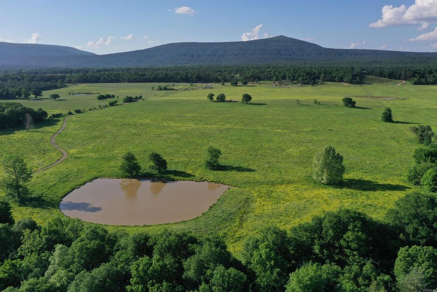 • 221 +/- acres • 190+/- acres of fenced pasture • 1 Mile of Poteau River Frontage • Cross Fenced into four pastures • Corral with New Arrowquip chute and scales • Two Feed bins for cattle feed • Multiple traps for holding cattle at corral • Fenced alleys between pastures for moving cattle • Frost Free cattle drinkers • Electricity and Rural Water on property • Excellent grass for Grazing and Hay • All Weather Road System • Excellent home sites • Two Ponds • Great deer hunting along Poteau River Bottom