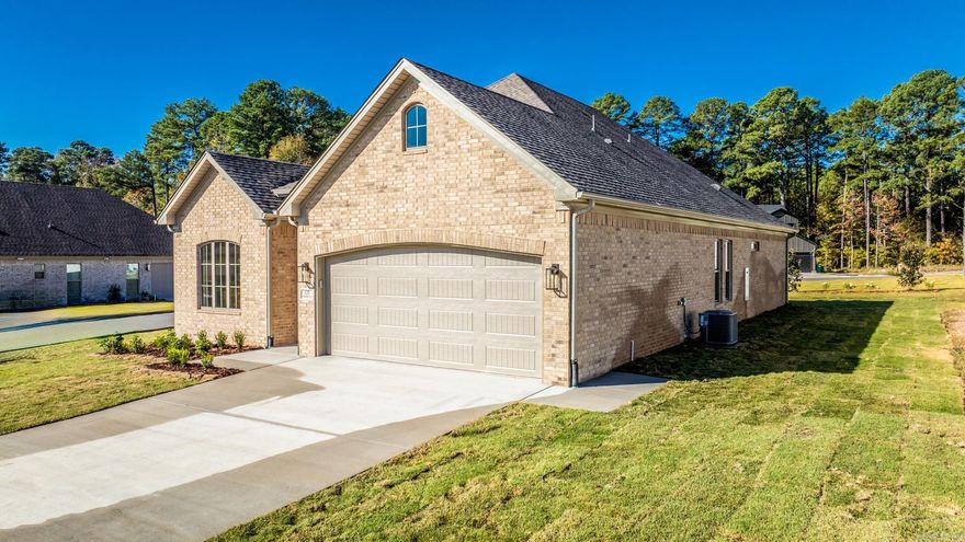 Welcome to Woodlands Park, where neighborhood charm meets suburban convenience. This thoughtfully designed home by Graham Smith is currently under construction with an anticipated completion date of June 2024. As you step inside to an open concept living area you will find tasteful designer finishes throughout. The heart of the home is the kitchen, featuring custom cabinetry, stainless steel appliances, and an island with a breakfast bar. The primary suite is complete with a walk-in closet & an en-suite bath featuring a double vanity, a soaking tub, & a separate shower. Two additional bedrooms & a shared full bath offer plenty of space for family or guests. The covered patio is perfect for enjoying the serene surroundings and you can rest easy knowing you will never have to mow again. Lawn care is included when you are a homeowner at Woodlands Park. Enjoy this beautiful new home, convenient location, and all WLR has to offer! Welcome Home!