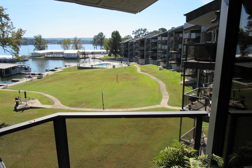 Fabulous location with a million dollar view of Lake Hamilton!  Fully furnished with a great potential for maximizing on nightly rental opportunities. Gorgeous, unobstructed main channel views from your private patio.  Includes a covered boat slip and is located on the top floor.  POA includes water, sewer, trash and yard maintenance and provides laundry facilities for owner occupants only.  These units can be very profitable grossing 30-40K per year.  STR License is transferable.