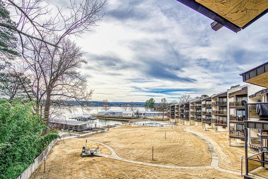 Fabulous location with a million dollar view of Lake Hamilton!  Fully furnished with a great potential for maximizing on nightly rental opportunities. Gorgeous, unobstructed main channel views from your private patio.  Includes a covered boat slip and is located on the top floor.  POA includes water, sewer, trash and yard maintenance and provides laundry facilities for owner occupants only.  These units can be very profitable grossing 30-40K per year.  STR License is transferable.