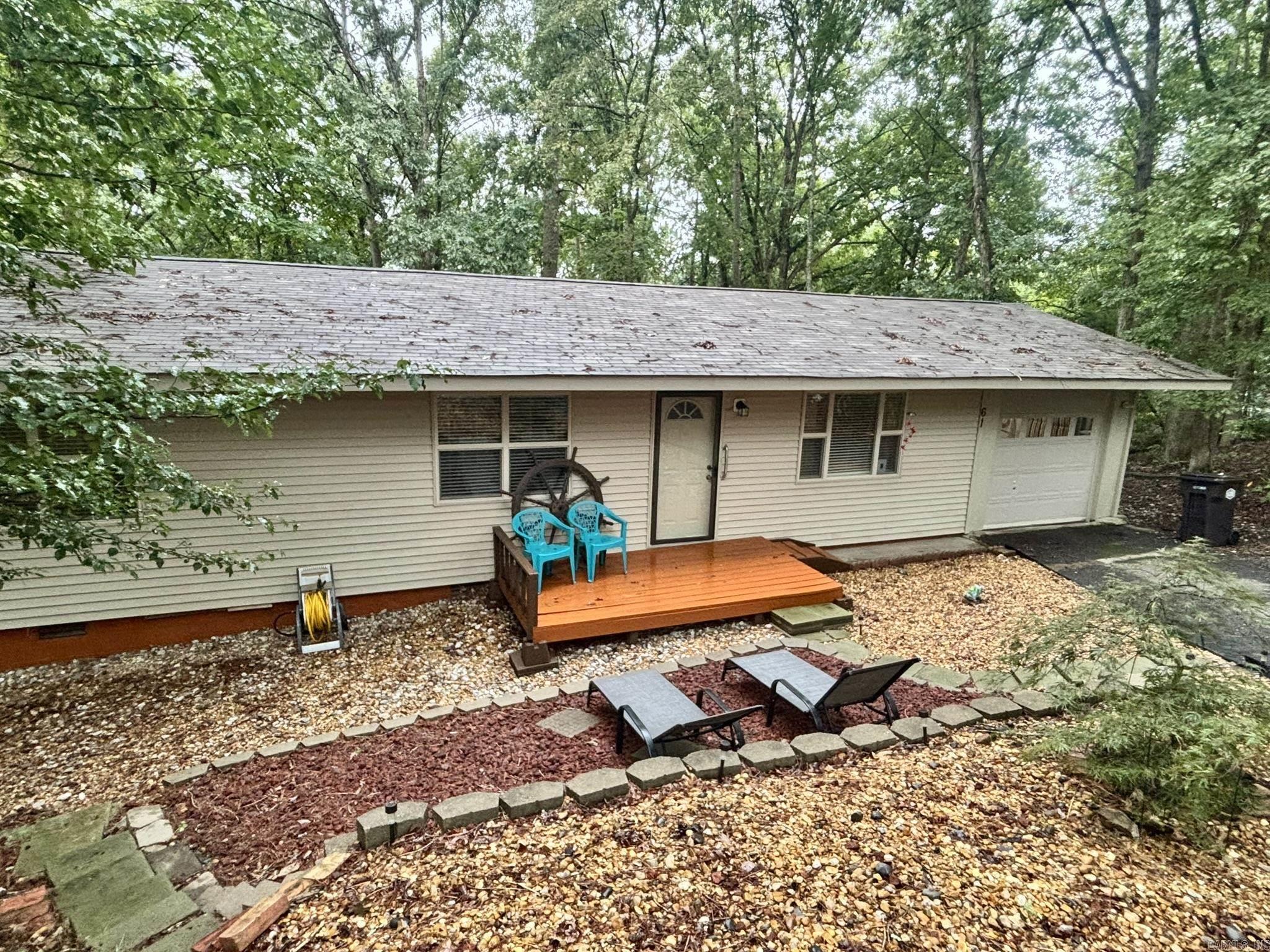Located in a cute neighborhood with a welcoming feel, this mostly furnished, charming three bedroom, one- and one-half bath home is ready for its next chapter. Step out on to the back deck and enjoy the peaceful wooded backyard ideal for relaxing, hosting barbecues or simply soaking up the quiet setting. A convenient one car garage adds extra storage and parking and includes an area for a workshop and washer and dryer connections. New roof 2025. Perfect for first time home buyers, investors wanting a turnkey rental or anyone looking to downsize. It's a great opportunity to invest in comfort, charm and value. This home is being sold mostly furnished and is move in ready. See agent remarks.