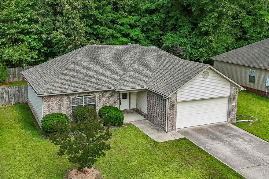 This one is just like a new construction home! It is neat, clean, and way more than move in ready! Great location in the heart of Cabot. Take an easy walk to Cabot's Community Pond to get some exercise on the lit walking trail, do a little fishing in the stocked pond or maybe some disc golf on the 18 hole course. There is even a dog park for your pup and pavilions with a grill! Playground equipment for the kids. The home has a fantastic split bedroom plan. The spacious living room is loaded with trim, has a double tray ceiling plus an electric log fireplace. The kitchen sparkles with stainless steel appliances, white cabinetry, and the fridge stays! Master bedroom has a tray ceiling detail. Master bath features twin sink vanity, jetted tub, a stand up shower, and walkin closet. Very private backyard with woods behind you!  Enjoy time on your covered back patio. Roof replaced in 2022. 2" blinds all through the home. Gutters with leaf screens around entire home. This house is the bomb! There is a floor plan is documents section.